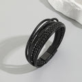 Multi-Strand Braided PU Leather Men's Bracelet in black with herringbone braid and magnetic clasp on grey background.