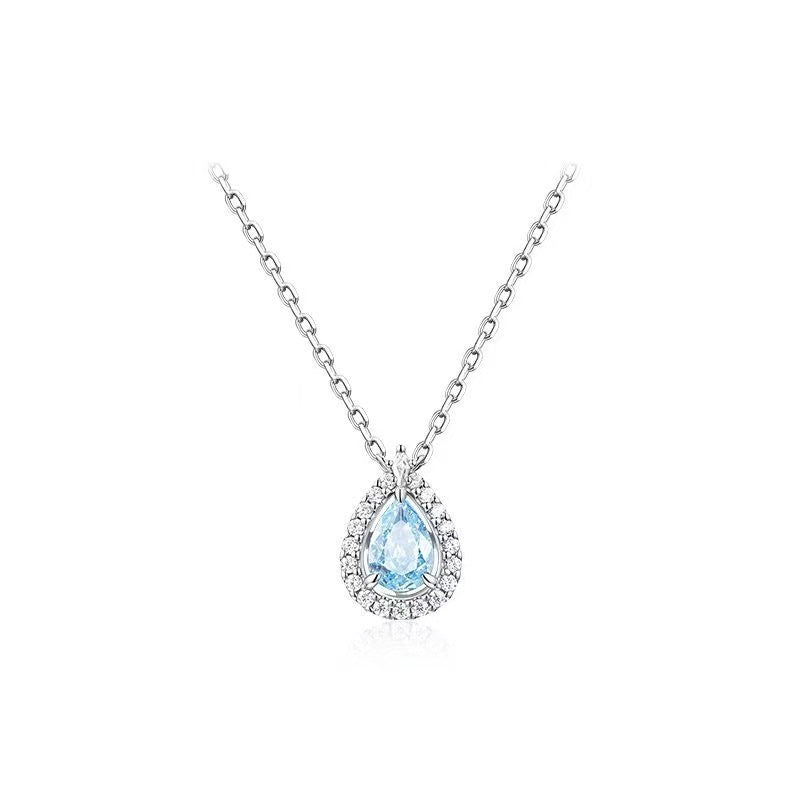 925 Sterling Silver Aquamarine Teardrop Halo Pendant Necklace with pear-cut crystal and halo setting.